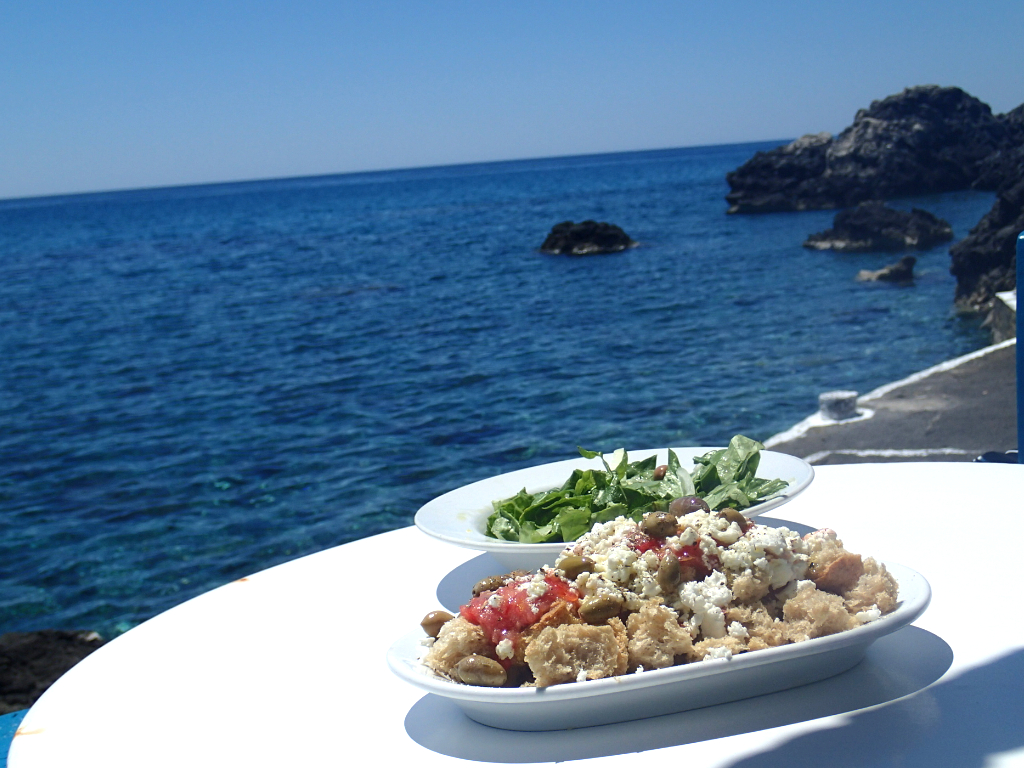 Table with small plates by the sea